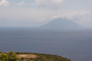 Sicily - Sunny impressions of the Aeolian Islands, also known as Aeolian Islands or Isole Eolie: Lipari, Stromboli, Salina, Vulcano, Panarea, Filicudi and Alicudi. Helipad on Panarea with a view of the Stromboli. Sicily - Sunny impressions of the Aeolian Islands, also known as Aeolian Islands or Isole Eolie: Lipari, Stromboli, Salina, Vulcano, Panarea, Filicudi and Alicudi. Helipad on Panarea with a view of the Stromboli.